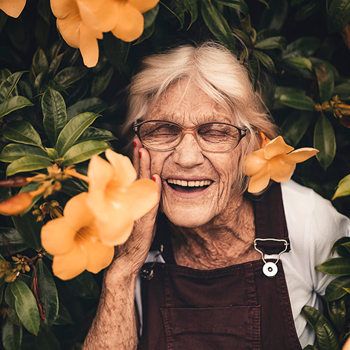 Laughing woman with flowers
